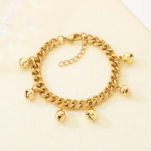 Detailed view of an 18K gold-plated stainless steel chain bracelet with bell pendants