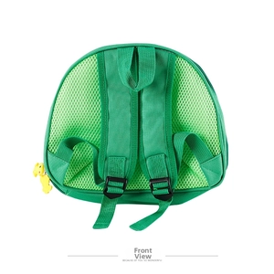Detail of green kids backpack featuring breathable honeycomb mesh back and dinosaur charm