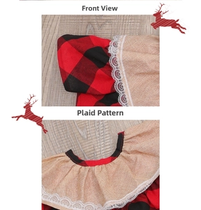 Detail of Christmas tree skirt with red black plaid pattern and white lace trim