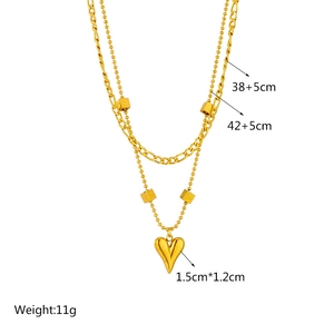 Double-layered gold titanium necklace featuring heart and square charms on white background