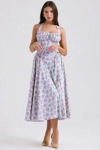 Close-up of light blue floral dress with corset waist and halter neck details