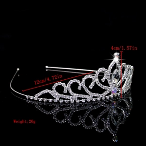 Detail of silver rhinestone crown showing 12cm width and 4cm height measurements