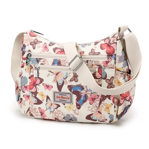Floral print crossbody bag with butterfly patterns and multiple compartments for women