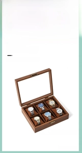 Detail view of 6-slot walnut wood watch storage box with glass lid and soft velvet pillows