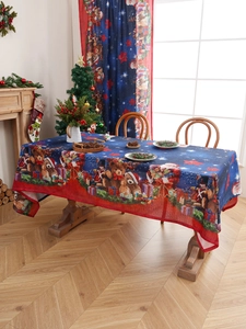 Detail of Christmas tablecloth featuring festive teddy bears and Santa on starry background