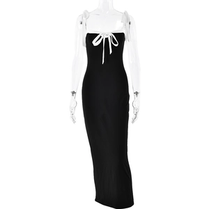 Elegant black bodycon maxi dress with white bow shoulder straps and tie-front detail