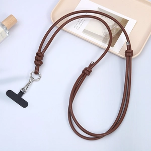 Detail of brown PU leather crossbody phone lanyard with silver metal clasp and adjustment ring
