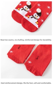 Detail of reinforced toe and heel on red cotton Christmas socks with snowman pattern