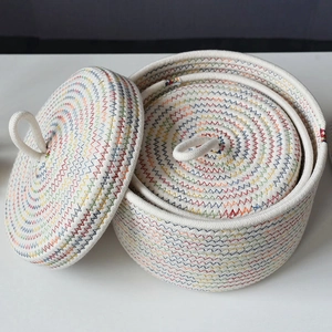 Three-piece nesting cotton rope storage baskets with lids and zigzag stitching