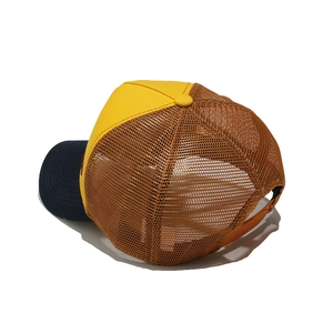 Detail view of the adjustable plastic snapback strap and mesh on a vintage trucker hat