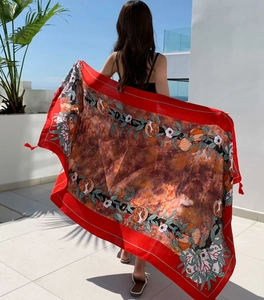 Red sun protection shawl with floral pomegranate print and bohemian tassels detail