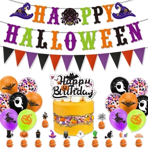 Detail of Halloween party set with Happy Halloween banners, cake toppers, and colorful balloons