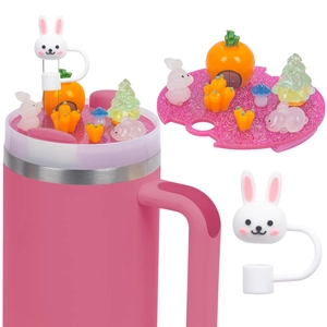 Detail showing a pink 40oz cup lid with rabbit straw topper and carrot house miniature