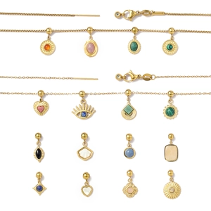 Golden stainless steel necklace charms set with colorful natural stones and shell motifs