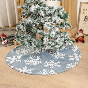 Light blue Christmas tree skirt with white snowflake patterns and soft plush texture