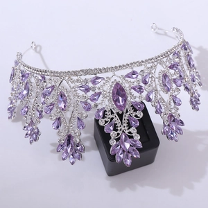 Macro shot of silver bridal crown featuring teardrop purple crystals and rhinestones