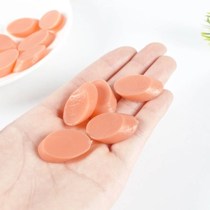 Realistic PVC miniature ham slices held in hand for DIY dollhouse kitchen decoration