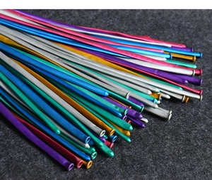 Detailed close-up of colorful metallic long twisting latex balloons for balloon animals