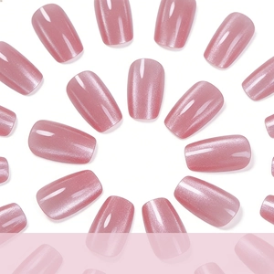 Pink cat-eye press-on nails in medium rectangle shape with shimmering glitter finish