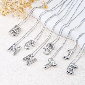 Silver balloon letter pendants on stainless steel chains featuring polished B, M, C, N, S, T, J, E