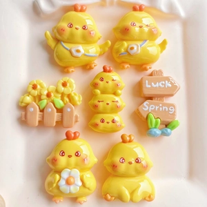 Set of seven yellow cartoon chicken resin charms with Luck and Spring signs for DIY crafts