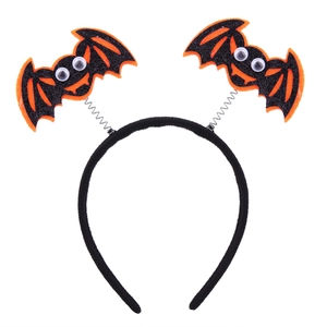 Detail of Halloween headband with black and orange glitter bats on metal springs