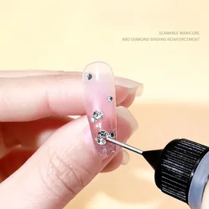 Nail art rhinestones glue with precision needle tip for filling gaps on pink manicure