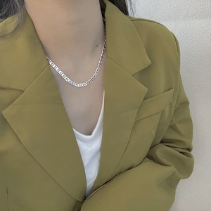 S925 sterling silver anchor link choker necklace on model in mustard green suit