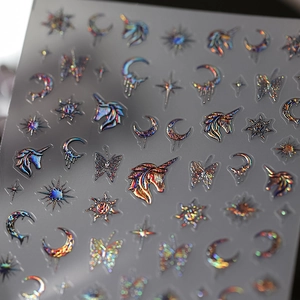 Holographic 3D nail stickers featuring unicorn, moon, and butterfly motifs with aurora finish