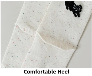Close-up of comfortable heel design on speckled yarn cotton socks with cat embroidery