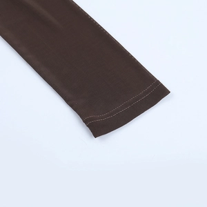 Close-up of double-stitch sewing on dark brown knitted long sleeve cuff texture