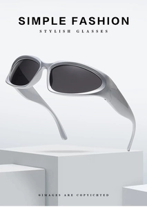 Detail view of matte silver sports sunglasses with sleek aerodynamic floating design