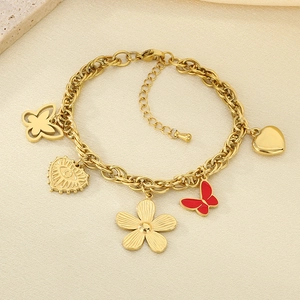 Detail of 18K gold-plated stainless steel bracelet with heart and butterfly charms