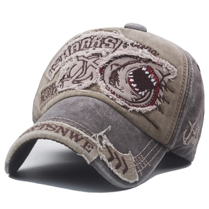 Vintage washed cotton baseball cap featuring shark patch embroidery and distressed details