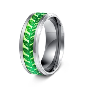 Close-up of titanium steel ring featuring green leaf texture inlay and silver finish