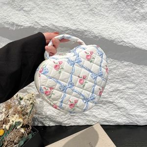 Quilted heart-shaped handbag with blue ribbon and pink rose floral pattern design