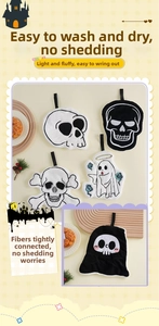 Detail of coral fleece Halloween hand towels with embroidery skull and ghost patterns