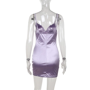 Detailed back view of purple satin bodycon dress with crisscross back straps