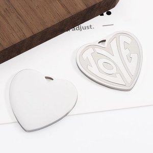 Polished stainless steel heart pendant with LOVE engraving and mirror finish back