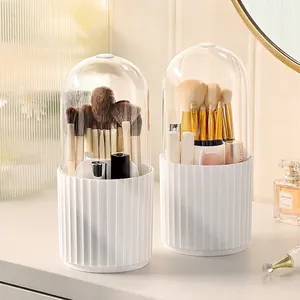 Rotating makeup brush holder with transparent lid and white base for vanity storage