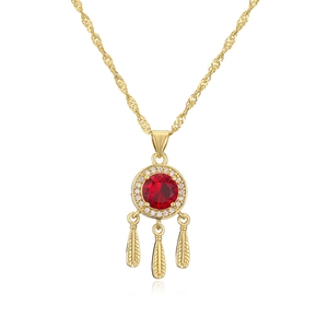 Detailed view of gold plated necklace featuring a red gem pendant with feather charms