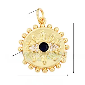 Macro shot of 21mm gold Evil Eye pendant with blue zircon stone and bead texture