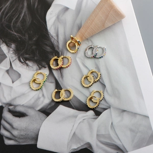 Detail shot of multi-colored S925 sterling silver hoop earrings with zircon stones