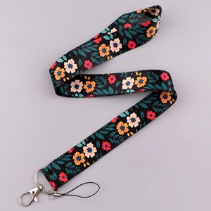 Close-up of spring floral lanyard with orange flowers and silver metal lobster clasp