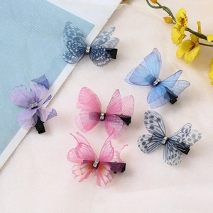 Close-up of double-layer tulle butterfly hair clips with rhinestones in 6 vibrant colors