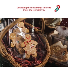 Detail of gingerbread man cookies in clear packaging with kraft Merry Christmas stickers