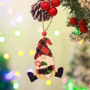 Wooden Christmas gnome pendant with red plaid hat hanging on a festive tree branch