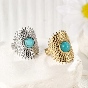 Golden and silver stainless steel rings with natural turquoise and dotted texture