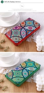 Ethnic style long zip wallets with colorful mandala patterns on a wooden desk setup