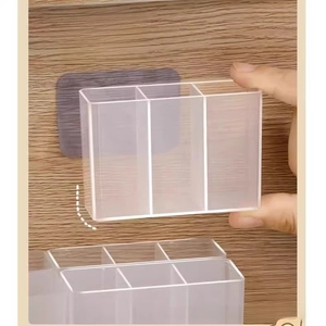 Wall-mounted acrylic organizer with adhesive strip for makeup and scissors storage